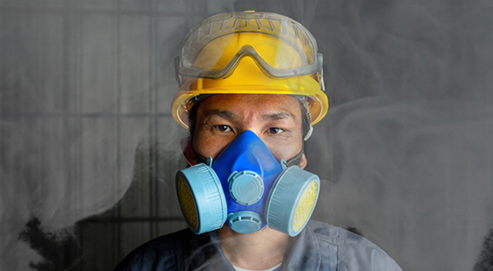 A worker wearing respiratory protection.