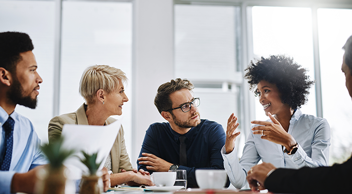 A group of employees having a team meeting.