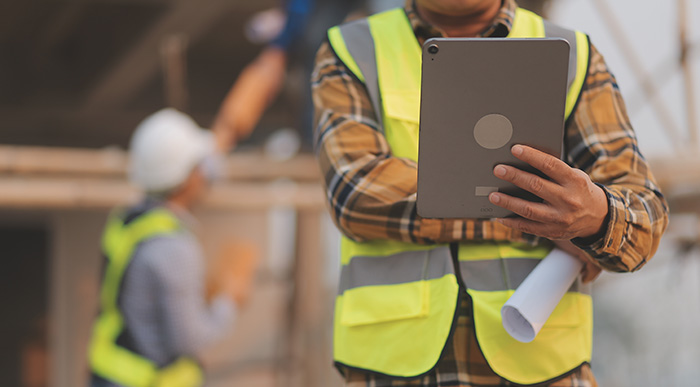 An employee looking at a tablet.
