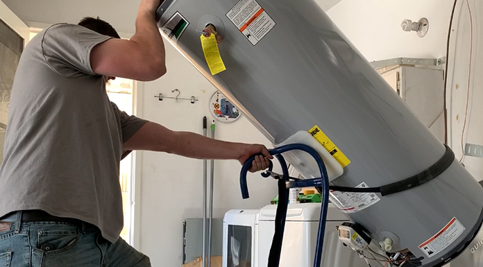 man-lifting-water-heater-blog