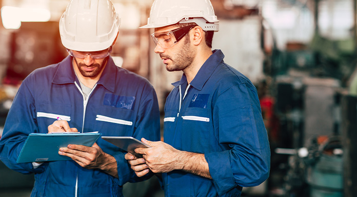Two employees reviewing documents.