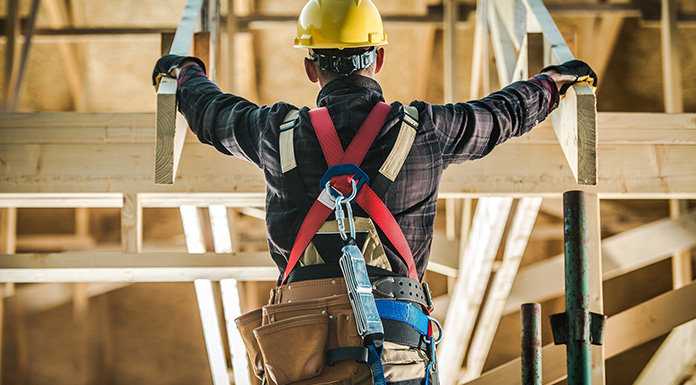 A worker working on a roof.
