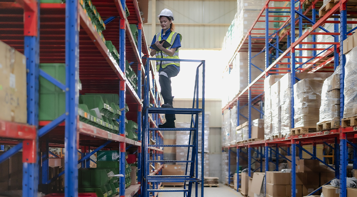 WCC - Construction Worker on Ladder at Warehouse - 696x385
