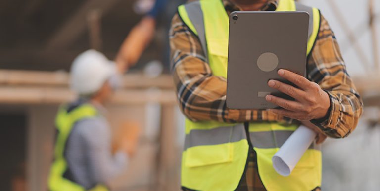 An employee looking at a tablet.