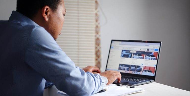 A person browsing cars online.