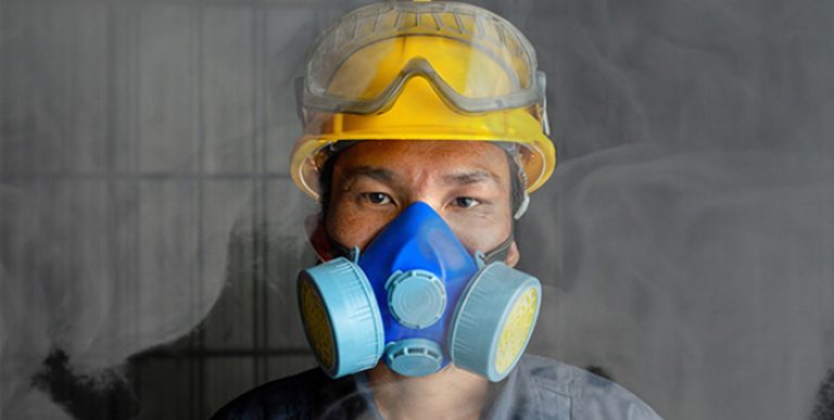 A worker wearing respiratory protection.
