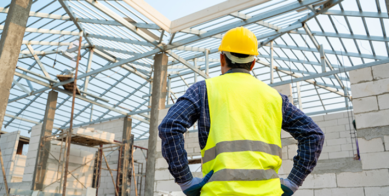 An inspector viewing a construction site.