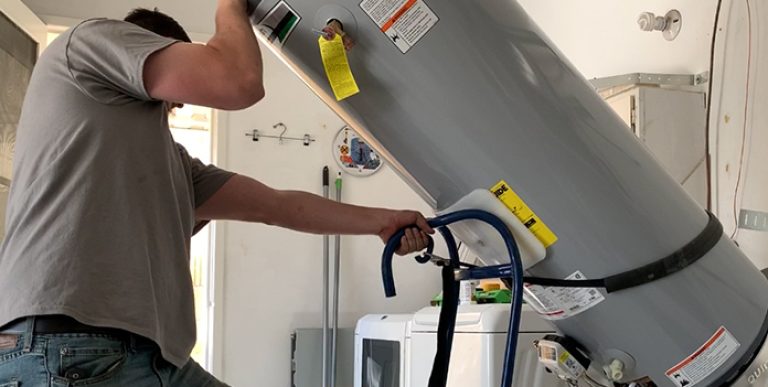 man-lifting-water-heater-blog