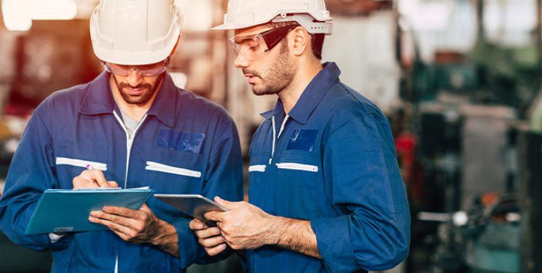 Two employees reviewing documents.