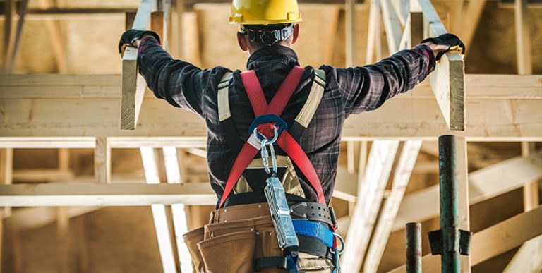A worker working on a roof.